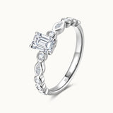 Emerald Cut Lab Grown Diamond Side Stone Engagement Ring in Sterling Silver
