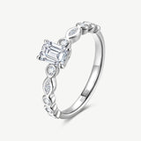 Emerald Cut Lab Grown Diamond Side Stone Engagement Ring in Sterling Silver